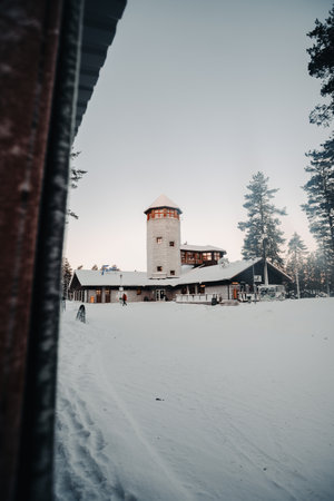 Entrance building in snowy forest to wildlife park in Ranua, Laplandの写真素材