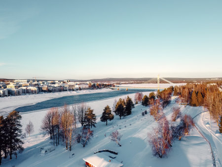 Aerial view of mostly frozen river in Rovaniemi, Lapland in winterの写真素材