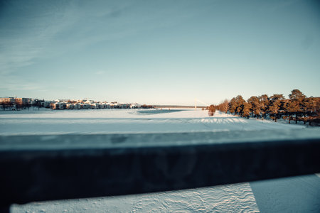 Frozen river on sunny winter day in Rovaniemi, Laplandの写真素材