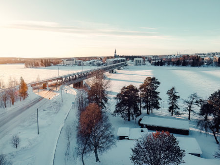 Aerial view of snowy Rovaniemi on sunny winter day in Laplandの写真素材
