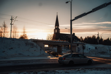 Church in Rovaniemi at sunset in winter in Laplandの写真素材