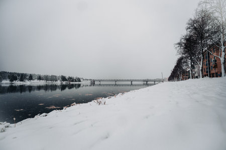 Railway bridge over Ounasjoki river starting to freeze in Rovaniemi, Laplandの写真素材
