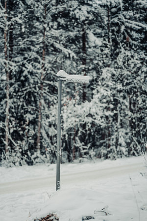 Snowy Luolakuja street sign in Rovaniemi, Lapland in winterの写真素材