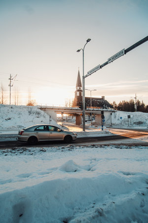 Car driving in front of church in Rovaniemi, Laplandの写真素材