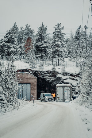 Van parked outside nuclear bunker in snowy forest in Rovaniemi, Laplandの写真素材