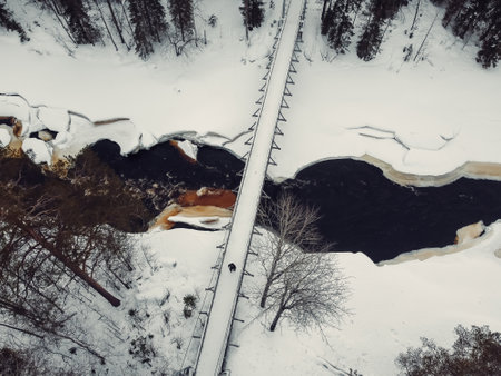 Half frozen arctic river in the snow shot from above in Rovaniemi, Laplandの写真素材