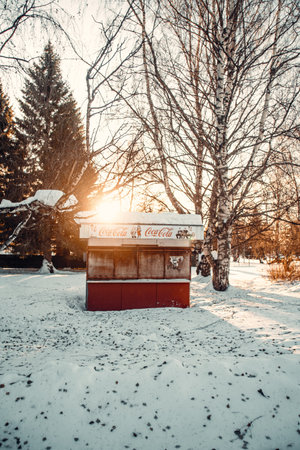 Closed red soda store in the snow in park in Rovaniemi, Laplandの写真素材