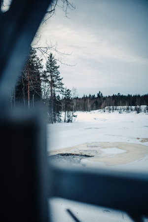 Frozen river at Vaattunkikongas in Rovaniemi, Lapland in winterの写真素材