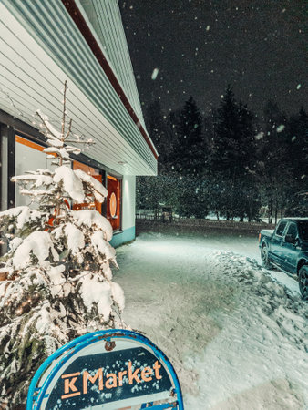 Snowing outside of grocery shop at night in Rovaniemi, Laplandの写真素材