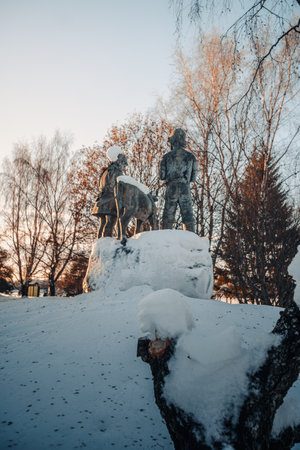 Statues in park in the snow in Rovaniemi, Laplandの写真素材
