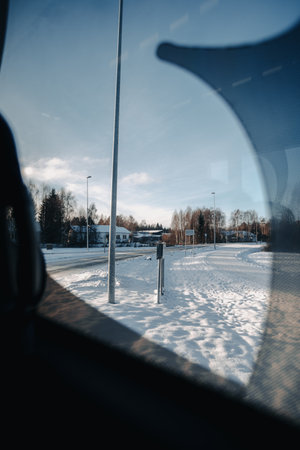 Snowy Rovaniemi street view out bus window in Lapland in winterの写真素材