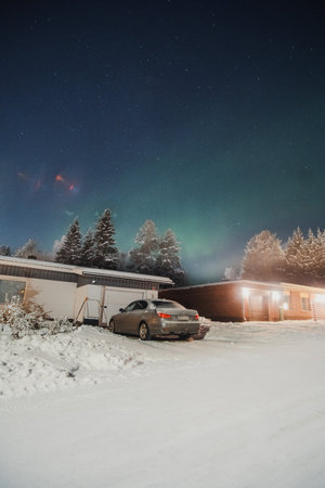 Faint northern lights in sky over house in Rovaniemi, Laplandの写真素材