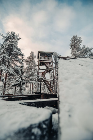 Lookout tower behind Ounasvaara laavu in Rovaniemi, Lapland in winterの写真素材