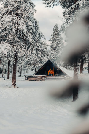 Snowy wooden laavu in Ounasvaara forest in winter in Rovaniemi, Laplandの写真素材