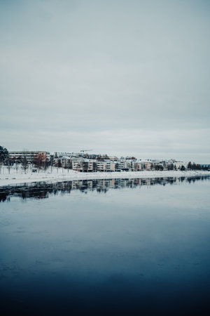Snowy Rovaniemi riverside view in early winterの写真素材
