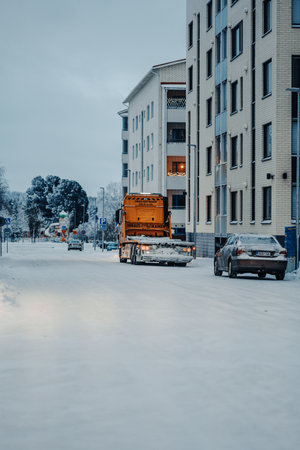 Truck on snowy road at twilight in winterの写真素材