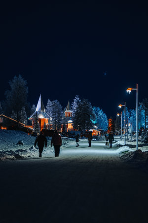 Snowy path to Santa Claus' Village at night in Rovaniemi, Laplandの写真素材