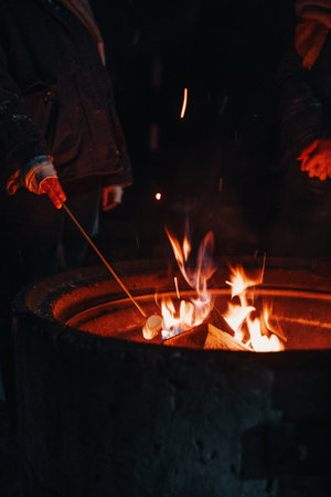 Marshmallow cooking next to flames in Rovaniemi, Laplandの写真素材