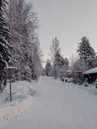 Syvasenvaara neighbourhood snowy road in winter in Rovaniemi, Laplandの写真素材