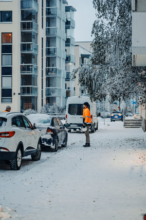 Worker on snowy pavement in Rovaniemi, Lapland in winterの写真素材