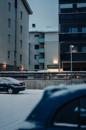 Snowy apartment blocks in Rovaniemi, Lapland in winter at twilightの写真素材