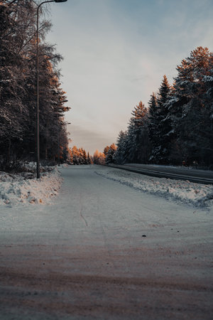 Snowy street in Rovaniemi at sunrise in winter in Laplandの写真素材