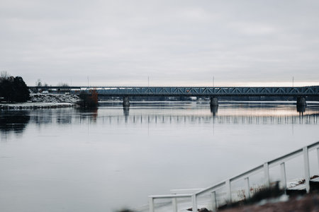 Railway bridge over Kemijoki in autumn in Rovaniemi, Laplandの写真素材
