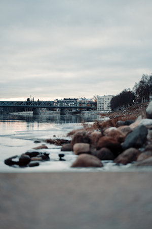 Kemijoki river and railway bridge in autumn in Rovaniemi, Laplandの写真素材