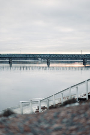Railway bridge over Kemijoki in Rovaniemi, Lapland in autumnの写真素材