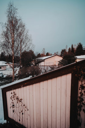 Snow on houses in Syvasenvaara in Rovaniemi, Lapland in autumnの写真素材