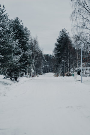 Snowy road in Syvasenvaara neighbourhood in Rovaniemi, Laplandの写真素材