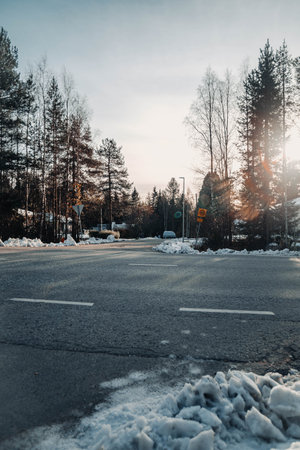 Road turning in Syvasenvaara in Rovaniemi, Lapland, bit of snowの写真素材