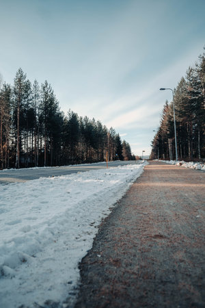 Bit of snow next to road in Rovaniemi, Lapland in autumnの写真素材