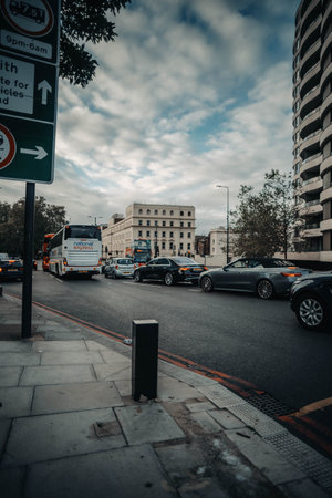 Cars on street in London at golden hour in London, UKの写真素材