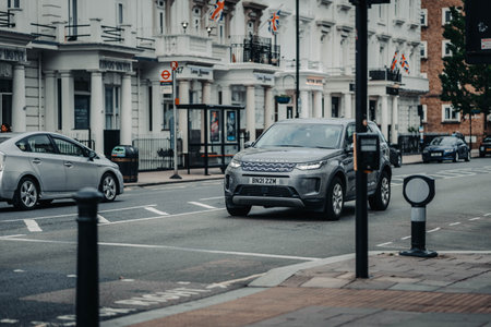 Cars on road outside posh houses in central London, UKの写真素材