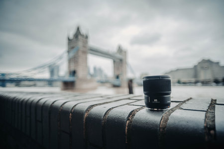 Camera lens in front of Tower Bridge in London, UK