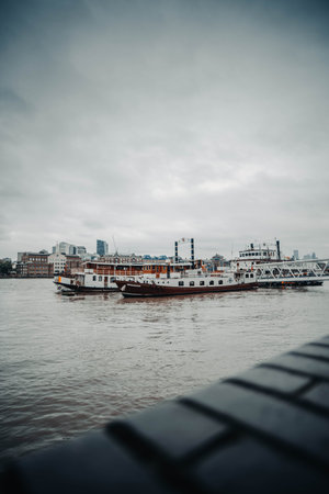 Boats on the River Thames in London, UK near Shad Thamesの写真素材