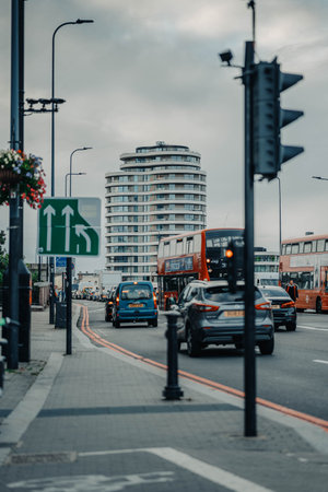 Red buses on street in Vauxhall, London, UKの写真素材