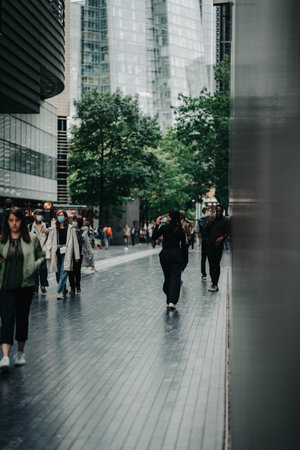 People walking down street in London, UKの写真素材