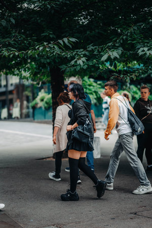 Crowd walking under tree in London, UKの写真素材