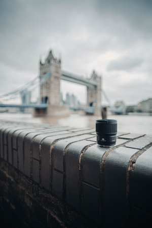 Camera lens on wall in front of Tower Bridge in London, UKの写真素材