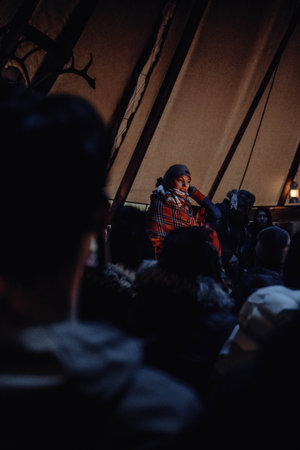 Saami woman singing in arctic hut near Tromso, Norwayの写真素材