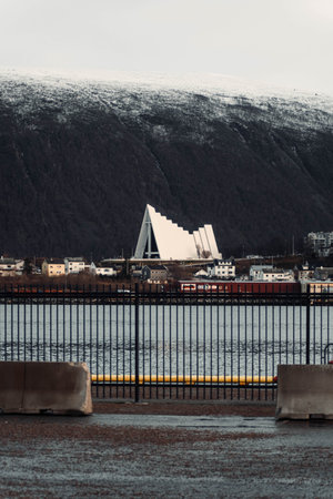 Arctic Cathedral in Tromso, Norway in front of snowy mountain in the arcticの写真素材