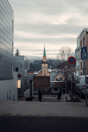 Tromso Cathedral in autumn with snowy mountains in the background, Norway