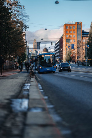Bus 67 on road in the center of Helsinki, Finland on sunny autumn dayの写真素材