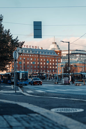 Buses in front of building in downtown Helsinki, Finland in autumnの写真素材