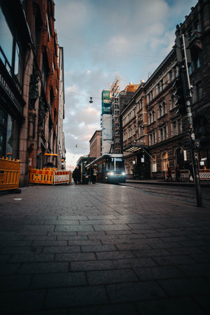 Tram at sunset on main shopping street in Helsinki, Finlandの写真素材