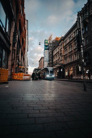 Tram on main street at sunset in autumn in Helsinki, Finlandの写真素材