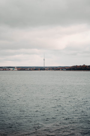 Tallinn TV tower in autumn above Estonian coastline next to Baltic seaの写真素材