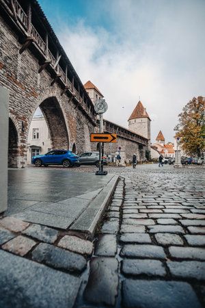 Old town city wall next to cobbled street in autumn in Tallinn, Estonia